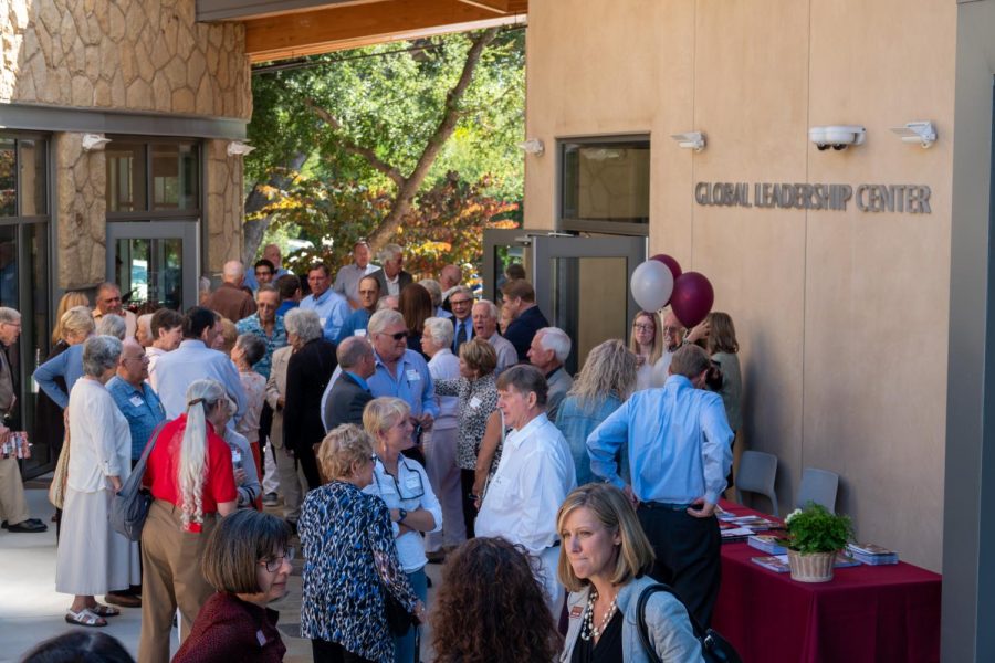 Alumni+and+guests+gathering+outside+the+Global+Leadership+Center+to+begin+their+Homecoming+Weekend.