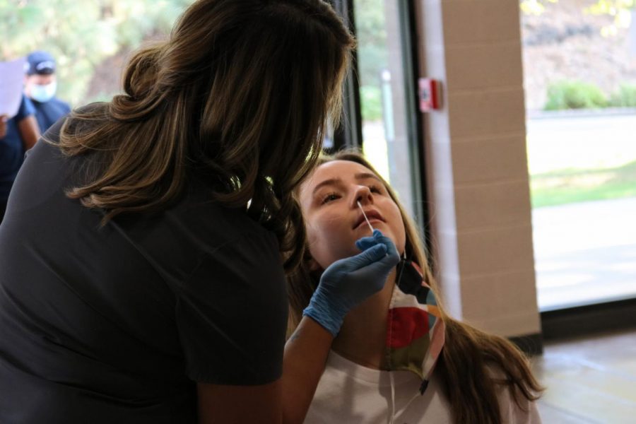 Ashley Rosenbaum gets a COVID-19 test as hundreds of students were re-tested last week.