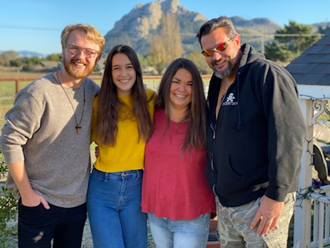 Maddy Booker (second from left) with her parents and fiancé