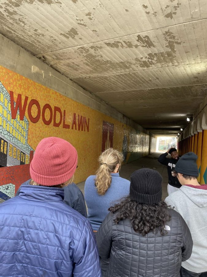 Students visit a community mural in Woodlawn during a neighborhood tour, led my CW Allen.