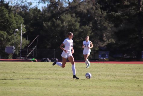 Fourth-year Sadie Hill making a run up the field in the GSAC championship.