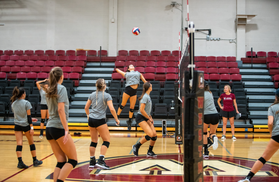 Womens volleyball players practicing for an upcoming match earlier this season. 