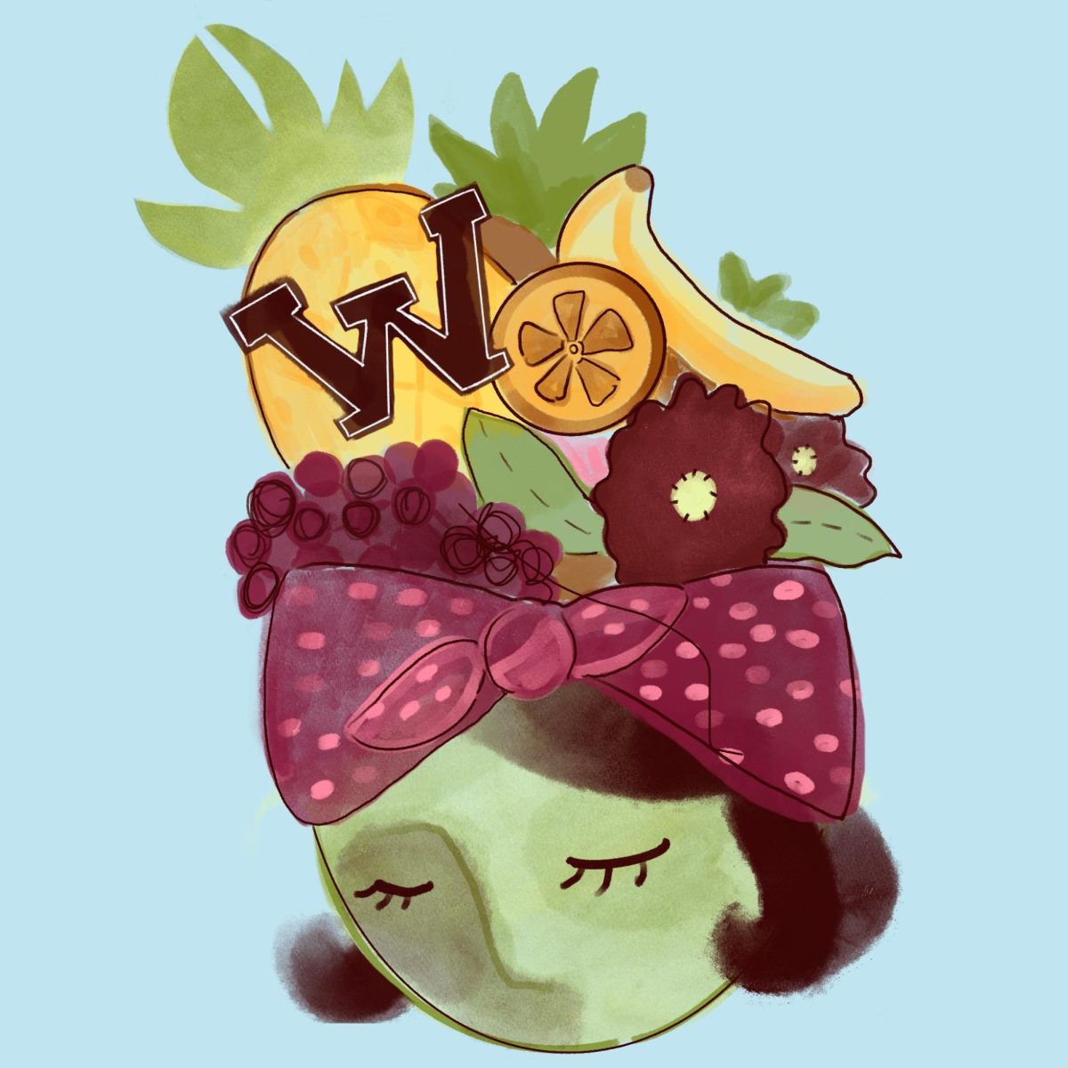 A student wears a hat piled high with fruits, with a Westmont logo at the top.