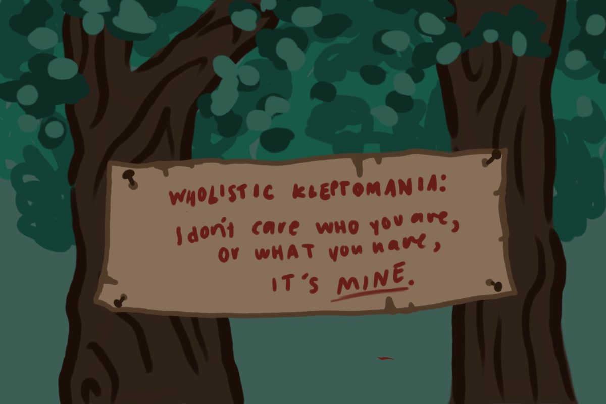 A sign hung between two trees reads, "Holistic Kleptomania: I don't care who you are or what you have, it's mine."