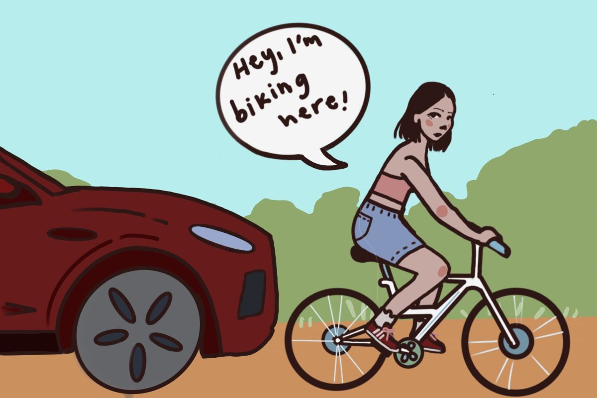 A student rides her bike on the street. A car is right behind her. A speech bubble reads, "Hey, I'm biking here!"