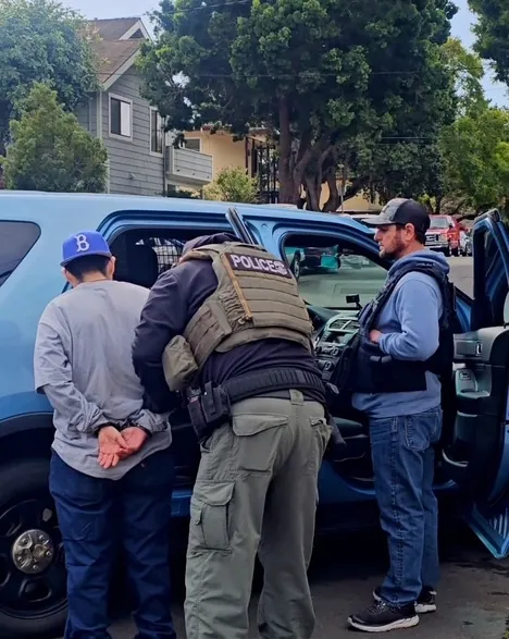 Officers from Immigration and Customs Enforcement taking a man into custody in Westside Santa Barbara in late January. Courtesy of the Santa Barbara Independent.