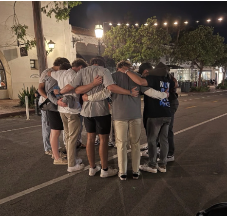 Baseball team gathers to pray over State Street 
